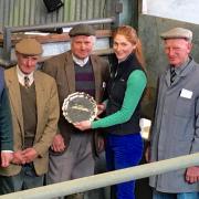 Kimberley Dudley of Allflex presents the salver to Phil and Mike Wood watched by Halls’ director James Evans (left) and judges Grahame and Clive Stubbs.