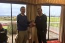 Ludlow Golf Club captain presents the Captain v Pro Series Cup to professional Russell Price