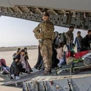 Afghan refugees being evacuated from Kabul as tensions heightened between British, US troops and Taliban forces. Picture: PA