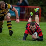 James Mear scoring one of his four tries in Ludlow's 99-0 win. Picture: Trevor Patchett