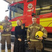 Vicki Dean with firefighters Prouse and Wright