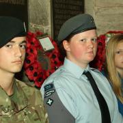 Army cadet Marcus Griffiths, air cadet Joanne Povall, and Chloe Powell-Bevan, of St. Laurence's Church Choir, will be reading out the names of the war dead. Photo: MARK BOWEN.