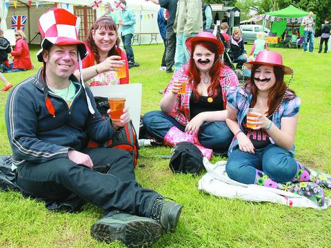 Adrian, Beverlye and Libby Chadwick, as well as Amy Siddell from Tamworth, enjoy the Teme Valley Food Festival during the jubilee weekend.