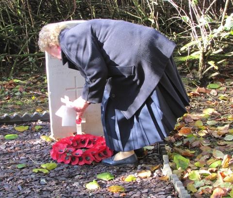 Lilian Franchi places a wreath of the grave of Henry Hill. The grave was re-discovered after a concerted effort to remove overgrowth from St Leonard's Churchyard a number of years ago. 