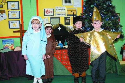 Pictured during rehearsals for Away in a Manger are: Laura Palmer, Jonah Crompton, Harry Shepherd and Bertie Wall, of Lindridge CE Primary School. 125052-3