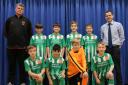 St Laurence Primary school pupils (back l-r) with Ludlow Town Colts manager Mark Tonkinson, Joshua Smart-Lynch, George Lynch, William Beasley, Finley Smart, St Laurence Primary school PE coach Mr Will Tisdale. Front (l-r) Riley Hughes, Oscar Crippin,