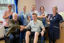 League of Friends Acting Chairman, Michael Evans thanking Squirrel Manager, James Grant, in the specialist ‘Milano' chairs, and accompanied by members of Ludlow hospital team