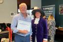 Healthwatch Hero George Rook receives his award from Shropshire high sheriff Mandy Thorn