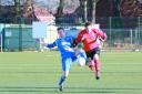 AFC Ludlow's Danny Gower, right, races for the ball. 125061-3 Picture: Keith Gluyas