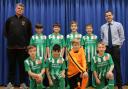 St Laurence Primary school pupils (back l-r) with Ludlow Town Colts manager Mark Tonkinson, Joshua Smart-Lynch, George Lynch, William Beasley, Finley Smart, St Laurence Primary school PE coach Mr Will Tisdale. Front (l-r) Riley Hughes, Oscar Crippin,