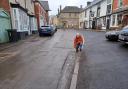 Nigel Hartin examines a stretch of road in need of repair