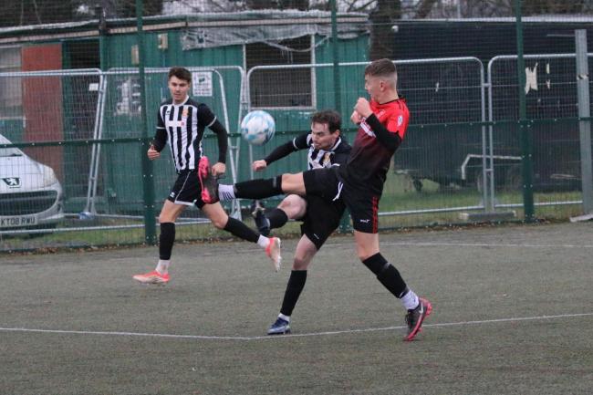 Josh Williams makes a tackle during Ludlow Colts' 2-1 defeat against Ledbury Town, Picture: Graham Gould
