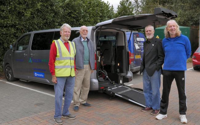 John Driver and Teme Wheels members with a vehicle similar to the one on order