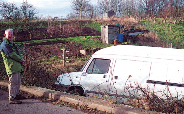Allotment holder Jim Nisbet surveys the scene in West Malvern, after a van ended up in the site in January 2003. Picture by Colin Jackson