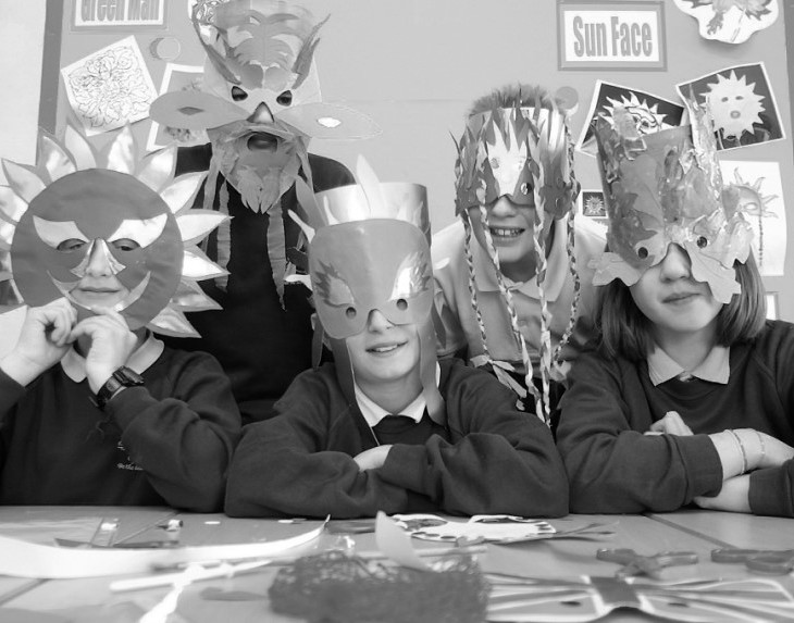 Behind the masks at the May Day workshop in 2003 are (from left) Adam Walker, Chris Reynolds, Louis Loader, James Cooper and Nicole Hutchins