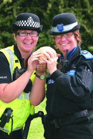 Police Officer Tracey Wood and Community Support Officer Teresa Howells enjoy a pork bap.
