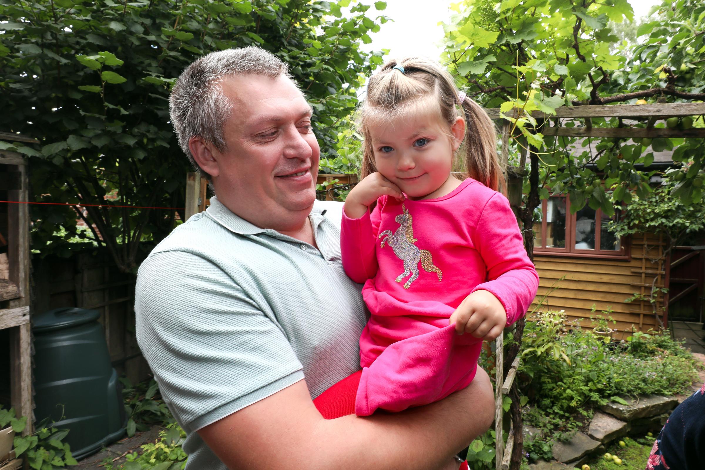 Pavlo Korniienko with his three-year-old daughter, Maria.