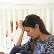 Frustrated Mother Suffering From Post Natal Depression.