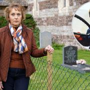 Laura Edwards stands near the grave of her little boy, inset, which now lies behind a chain-link fence at a decaying church. Picture: Rob Davies