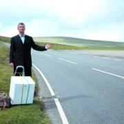 Getting the cold shoulder on the hard shoulder? Tony Hawks hitches with a fridge.