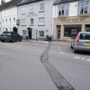 Cars using the charging points outside the Blue Boar pub in Ludlow