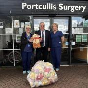 Advanced nurse partner Joy Godding and health care assistant Angie Runicles receive their first delivery of Teddy Bears from Tom Kiely, Shropshire Freemasons.