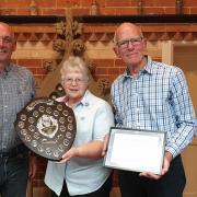 Meryl Handley receives her award from the Deputy Mayor of Tenbury, Cllr Graham Brittain (left) and the Mayor of Tenbury, Cllr David Patrick
