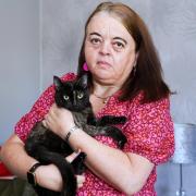 Maxine Broome with her cat Maxine, who was shot by an air rifle