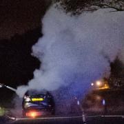 Firefighters tackle a car fire near Tenbury Wells