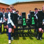 Pupils at Wigmore School with the scrummaging machine funded by the Kingspan Insulation Community Trust