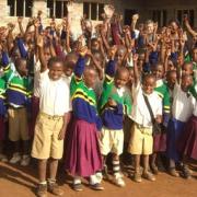 Children in the village celebrate the building of their classrooms.