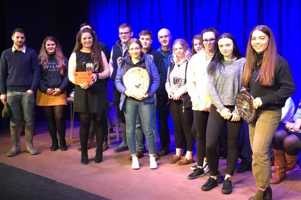 Holding The main Shield in the Centre is Katie Beaumont (Club Secretary) and to her right with the First Prize Card and cup is Harriet Beaumont (Club Chair). Amy Parry is the one holding the other shield on the near right of the picture.